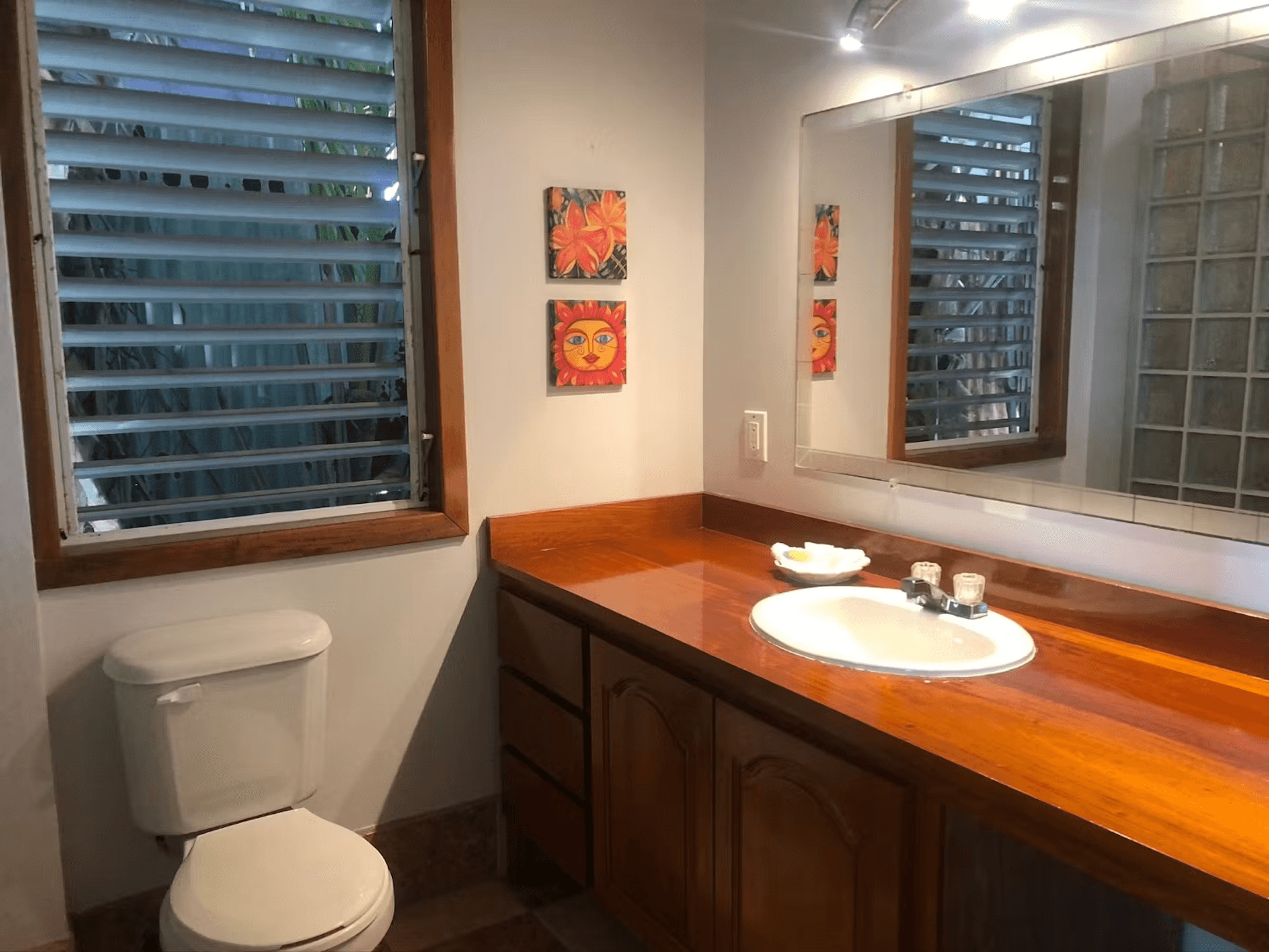 Bathroom with beautiful hardwood vanity, sink, toilet
